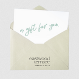 Gift card in an envelope with 'Eastwood Terrace' branding on a white background